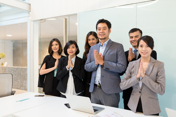 Thai style greeting in business office