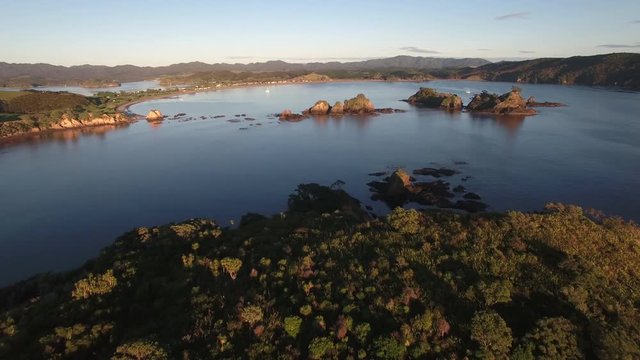 Aerial establishing shot of Bland Bay in New Zealand