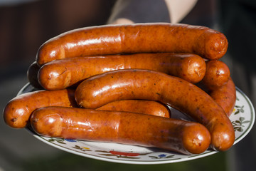 Smoked sausages on a plate.