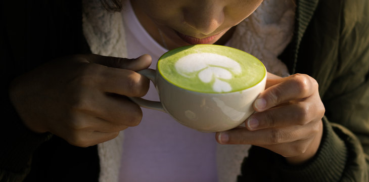 Young Woman Drinking Green Tea