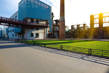 Empty road surface floor with old steel steelworks of pipelines