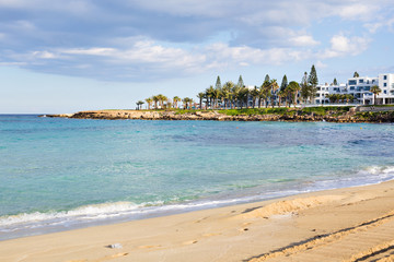 Travel, vacation, summer concept - Beautiful landscape beach, Cyprus island, Mediterranean Sea. Amazing blue sea and sunny day.