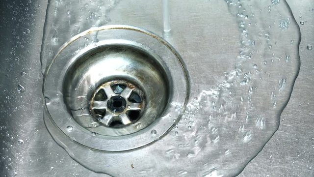 Close-up View of Kitchen Sink with Water. 4K