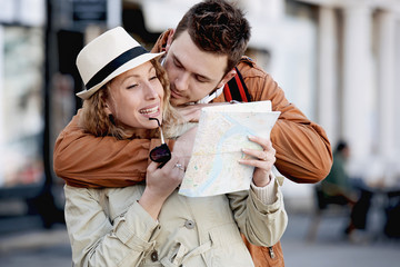 Tourist Couple Walking in Downtown and Looking at Map