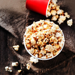 Homemade Kettle Corn Popcorn on wooden rustic table with copy space .