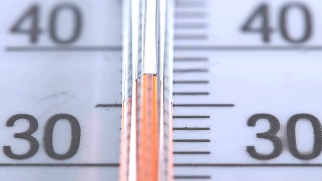Red scale on the thermometer, close-up