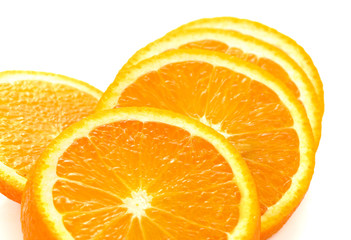 Fresh orange slices on white background. Close-up. Studio photography.