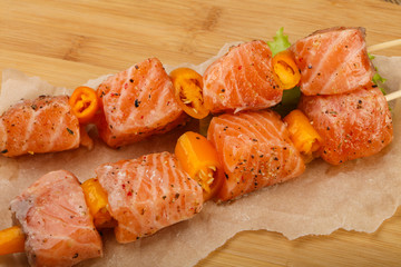 Raw salmon skewer