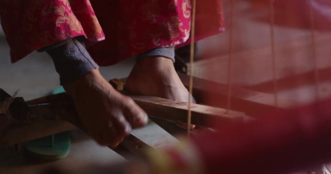 Nepali women makes a Pashmina Shawl the traditional way in Bhaktapur, Nepal