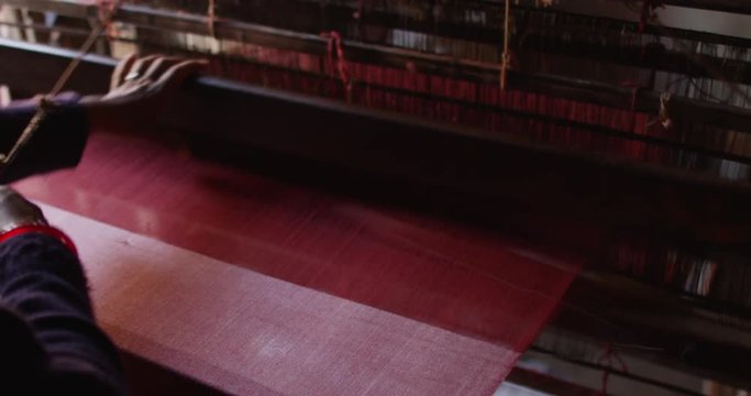 Nepali women makes a Pashmina Shawl the traditional way in Bhaktapur, Nepal