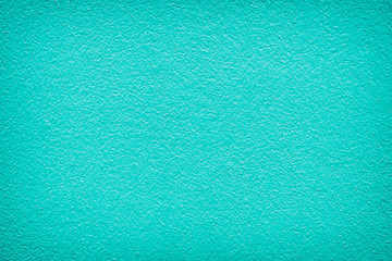 Textured background. Green painted wall.