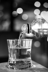 Pouring water from bottle