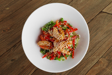 Salad with fried chicken, bell pepper, sesame and green beans