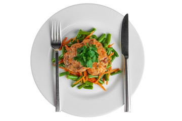 Top view of fish cutlet with green bean and carrot isolated on white.