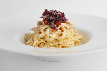 Close-up view of spaghetti with onion marmalade