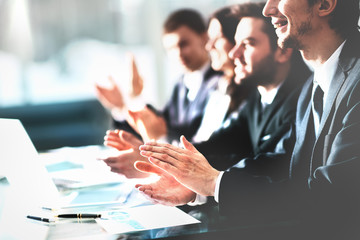 Close up view of business seminar listeners clapping hands. Professional education, work meeting, presentation or coaching concept.