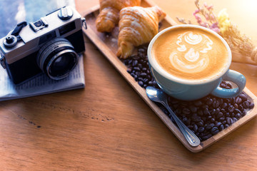 Top view of office desk with coffee and accessories.