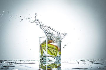 water splash in glass of gray color