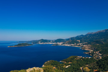 Naklejka na ściany i meble Panorama of the coastline of Budva Riviera from the mountain on a sunny day. Montenegro.