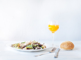 Delicious salad with cucumber and chicken. Juice and roll. Breakfast. The concept of food and diet.
