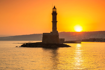 Lighthouse of the old Venetian port in Chania at sunrise, Crete. Greece