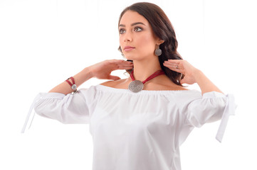 Portrait a beautiful young woman model with silver jewelry