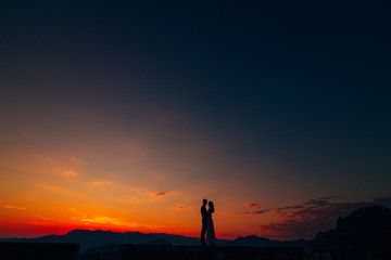 Silhouettes at sunset on Mount Lovcen in Montenegro