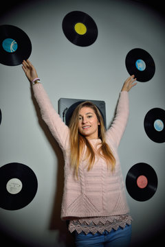 Young woman with vinyl discs