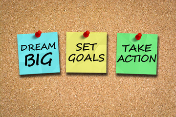 Dream big, set goals, take action, success recipe on cork billboard