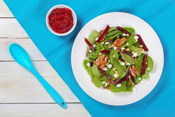 caramelized walnuts salad on white plate