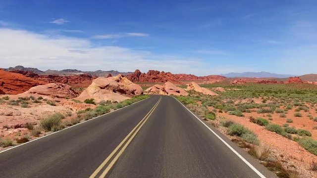 Incredibly beautiful landscape in Southern Nevada, Valley of Fire State Park, USA. Smooth camera movement along the road.