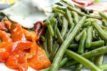 Fresh salad - Delicious fresh salad with tomatoes, lettuce, eggplant, zucchini, cheese, parma ham and olive oil.