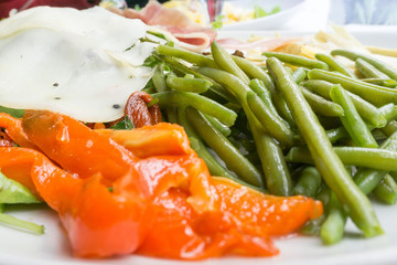 Fresh salad - Delicious fresh salad with tomatoes, lettuce, eggplant, zucchini, cheese, parma ham and olive oil.