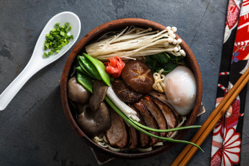 Mixed oriental mushroom stir fry with noodles soup and spring onion