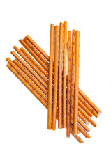 Heap of salty bread sticks isolated on white background