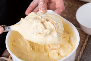Mixing citrus peels with cake dough.
