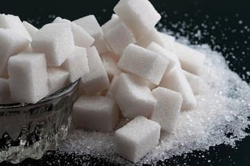 Two kind of sugar on black surface