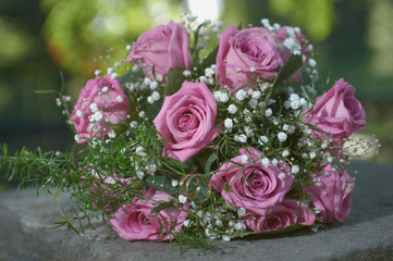 pink rose wedding bouquet with two gold ring