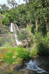 Fototapeta na wymiar big high waterfall coming from the mountain
