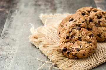 Chocolate chip cookies on wooden table background
