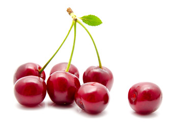 Juicy cherry with leaf isolated