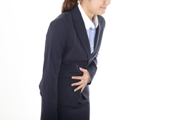 Obraz na płótnie Canvas 腹痛を訴える女性