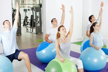 Group of people doing relaxation exercise.