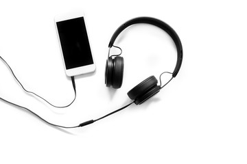 Headset and a phone on white background