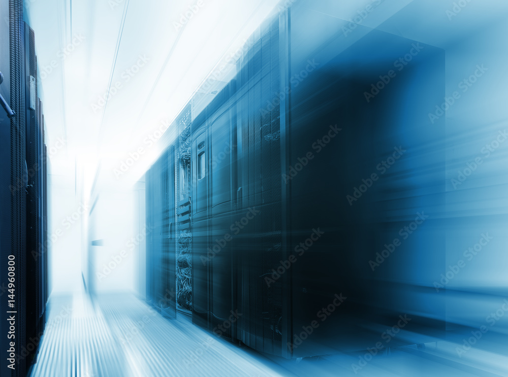 Poster mainframe clusters in modern data center with blur and motion blue tone