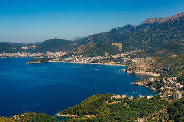 Naklejka na ściany i meble Panorama of the coastline of Budva Riviera from the mountain on a sunny day. Montenegro.