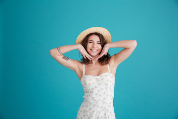 Portrait of a happy smiling girl wearing hat and posing