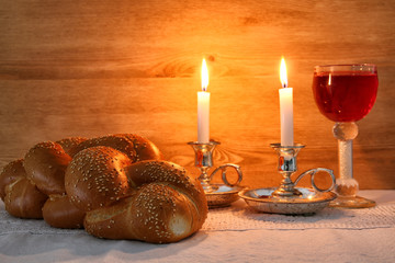 shabbat image. challah bread, shabbat wine and candles