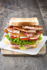 Club sandwich on wooden table 
