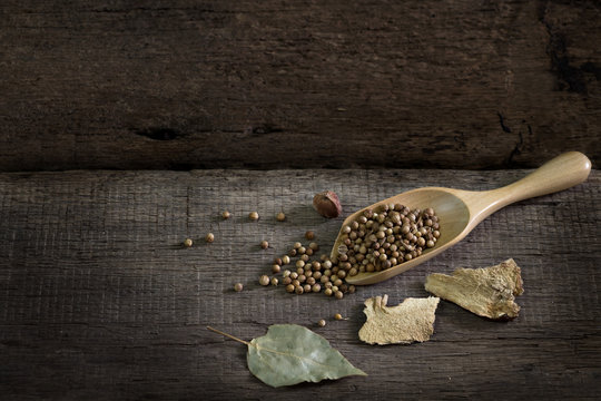Spices and herbs on old kitchen table. Food and cuisine ingredients.